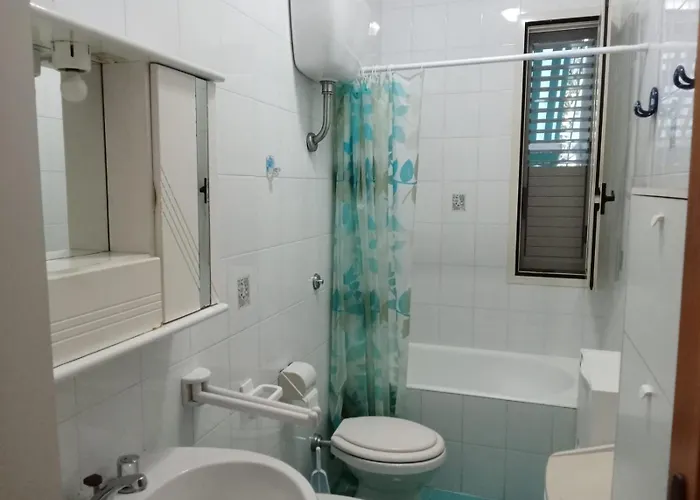 Bilocale Con Giardino Baia By Nonsolomare Vacanze Srlu Apartment